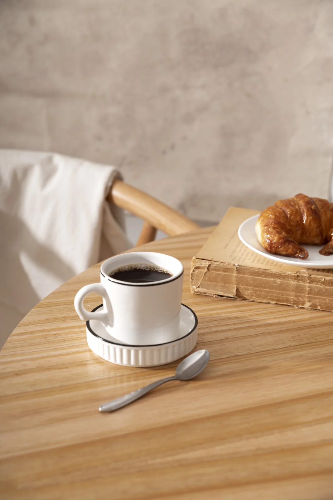A cup of coffee on a wooden table